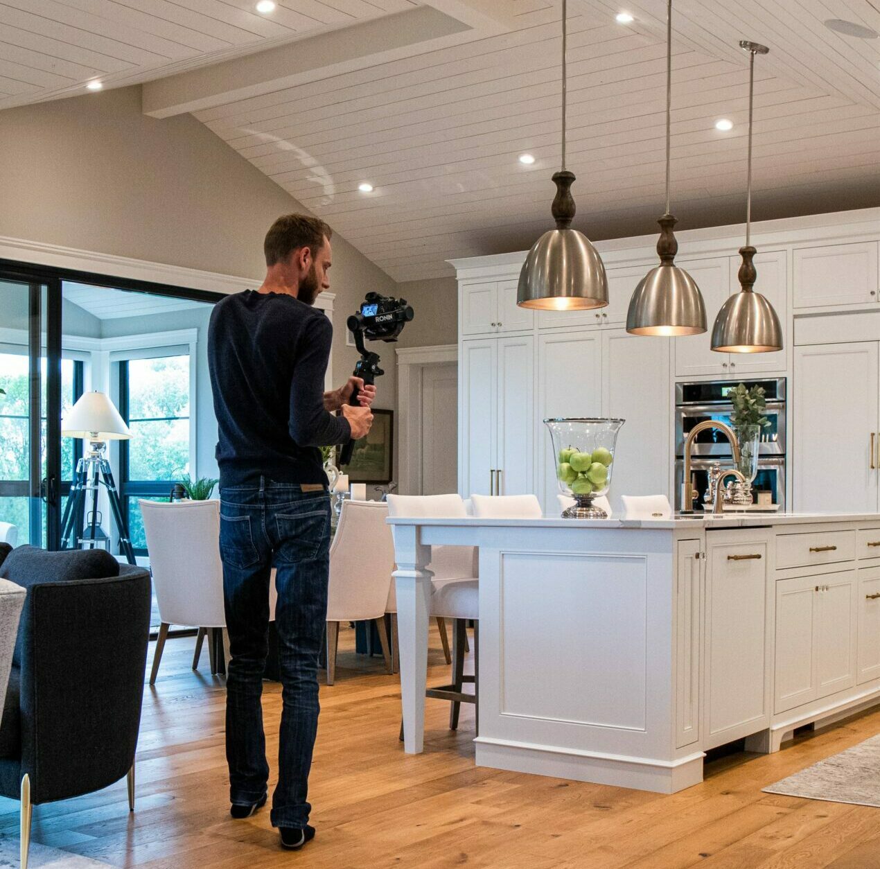 photographer filming a house for real estate video.